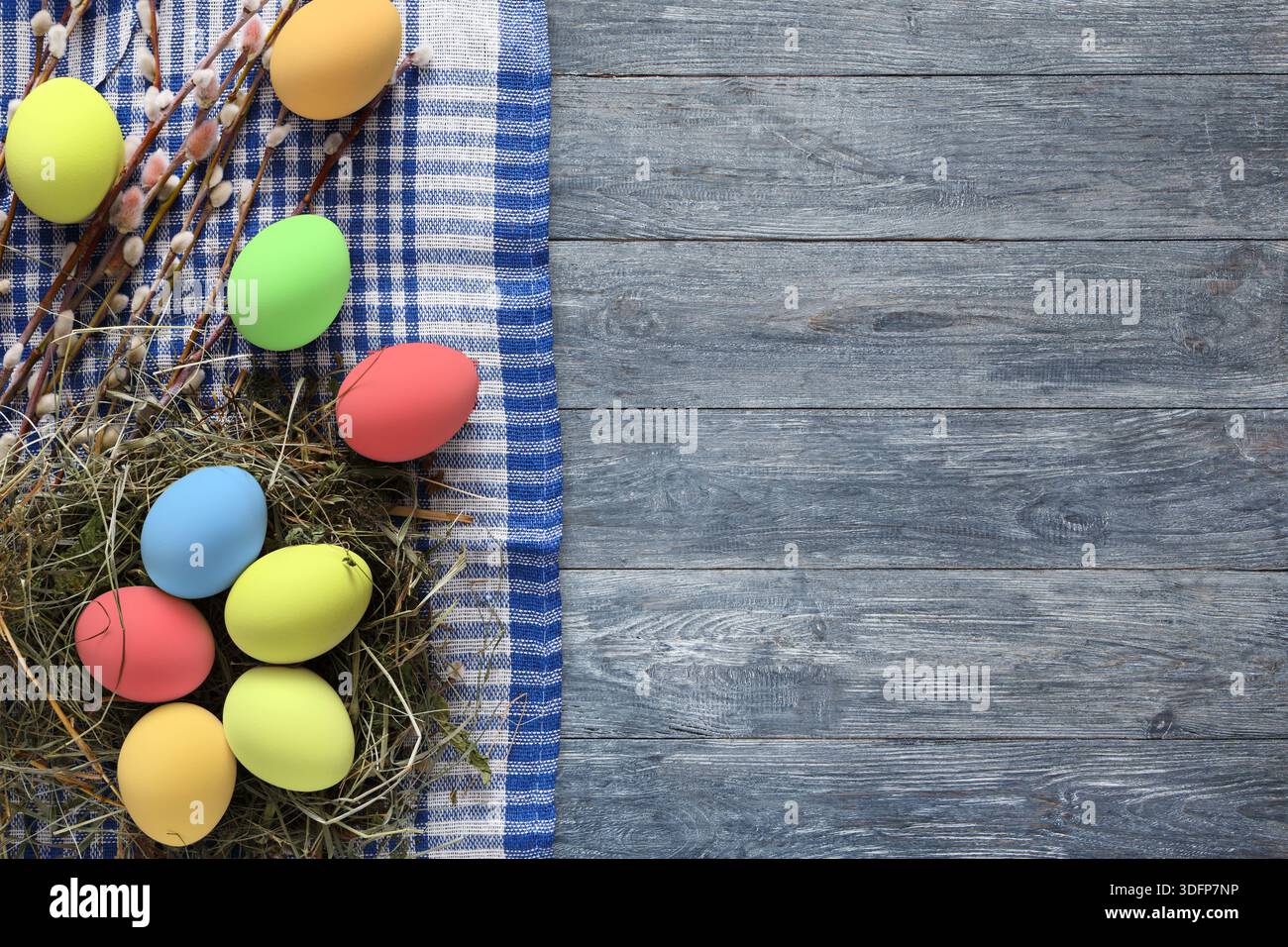 Colorful Easter Eggs Arranged on a Rustic Wooden Surface With Decorative Elements Stock Photo