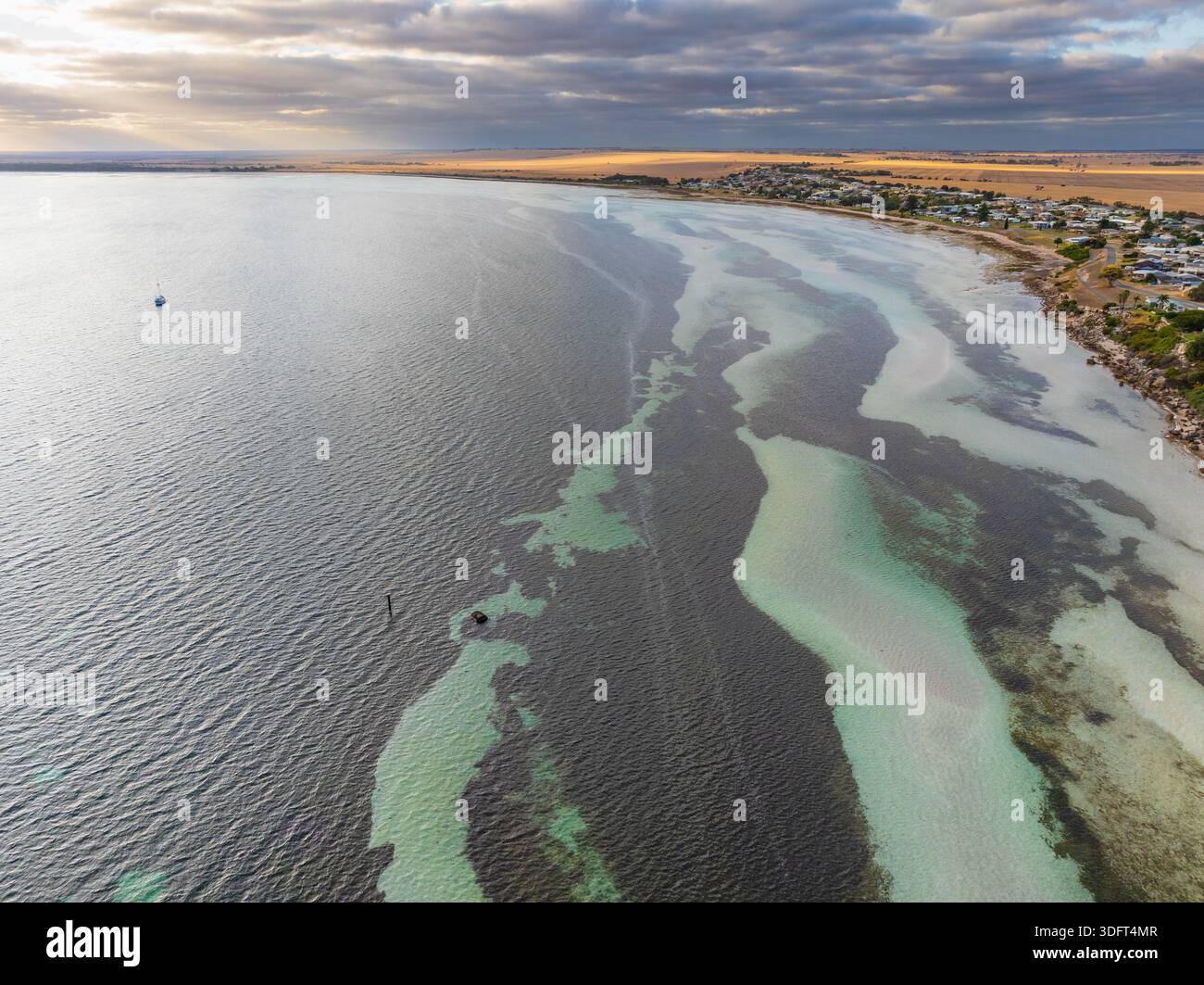 Point Turton Aerial view of tidal patterns along the shoreline of a coastal town at ...