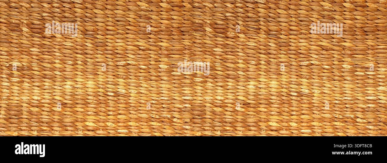 Brown natural fiber creating a detailed woven wicker basketry texture Stock Photo