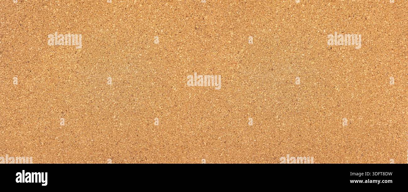 Cork material showing a grainy texture suitable for background use Stock Photo