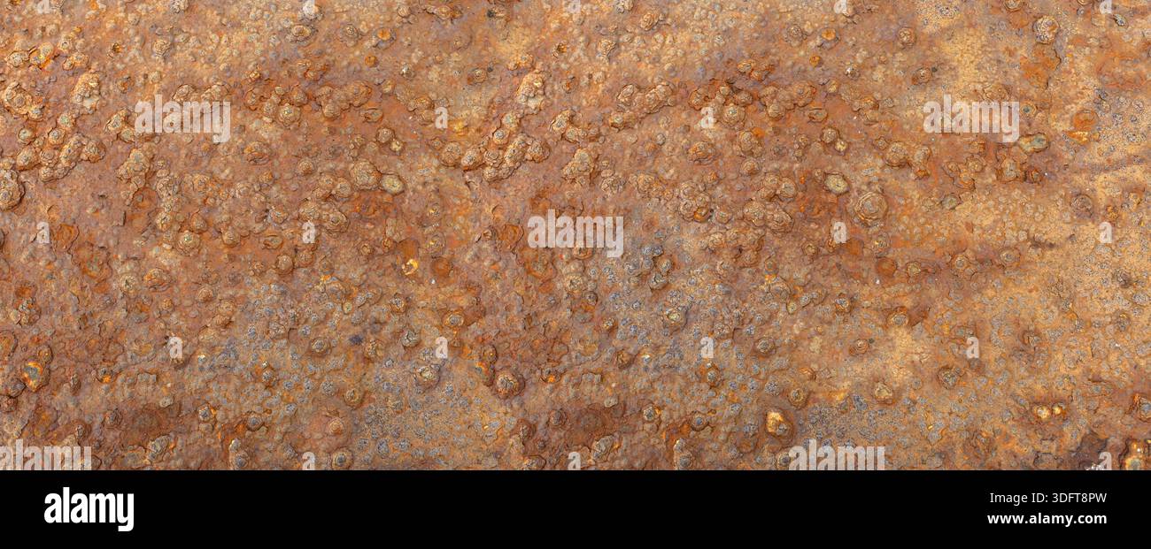 Rusty metal texture displaying corrosion and degradation over time Stock Photo