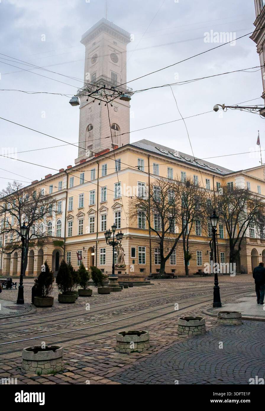 lviv, ukraine - 17 nov 2012: view of lviv city architecture on a misty morning. concept scene of old town with cobblestone street. background for trav Stock Photo