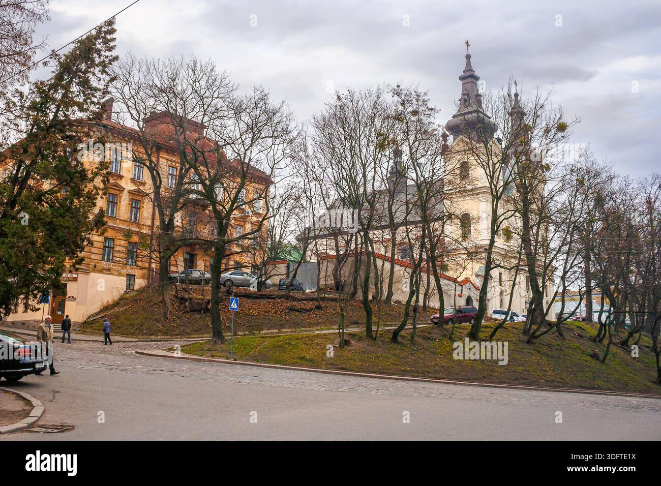 lviv, ukraine - 17 nov 2012: view of lviv city architecture on a misty morning. concept scene of old town with cobblestone street. background for trav Stock Photo