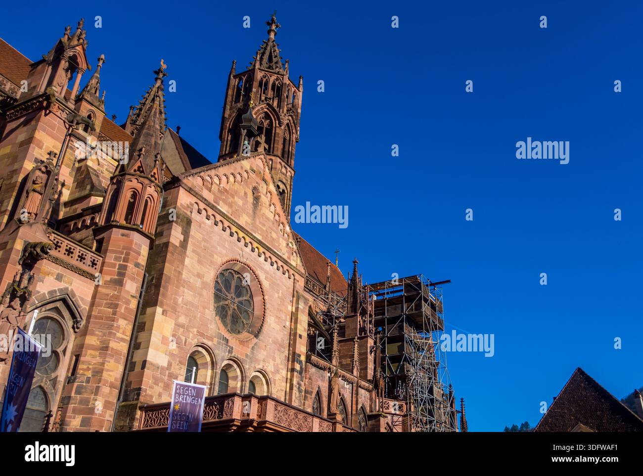 Low-angle view of Freiburg Cathedral (Muenster - Minster) in Freiburg, Germany - Stock Image
