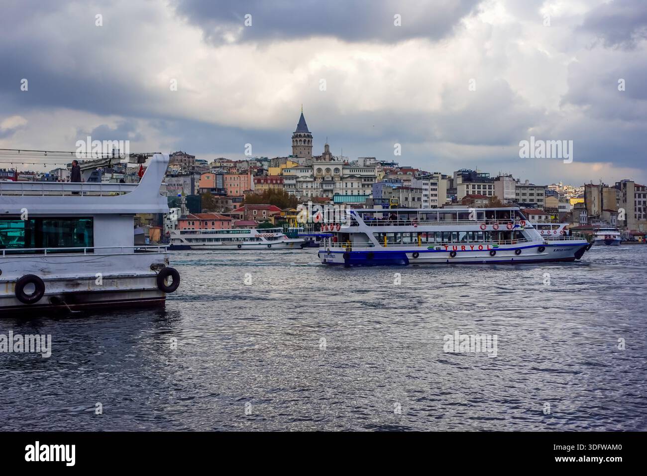 Istanbul, Turkey - December 2, 2025 - ferries on the Golden Horn on a moody day - Stock Image
