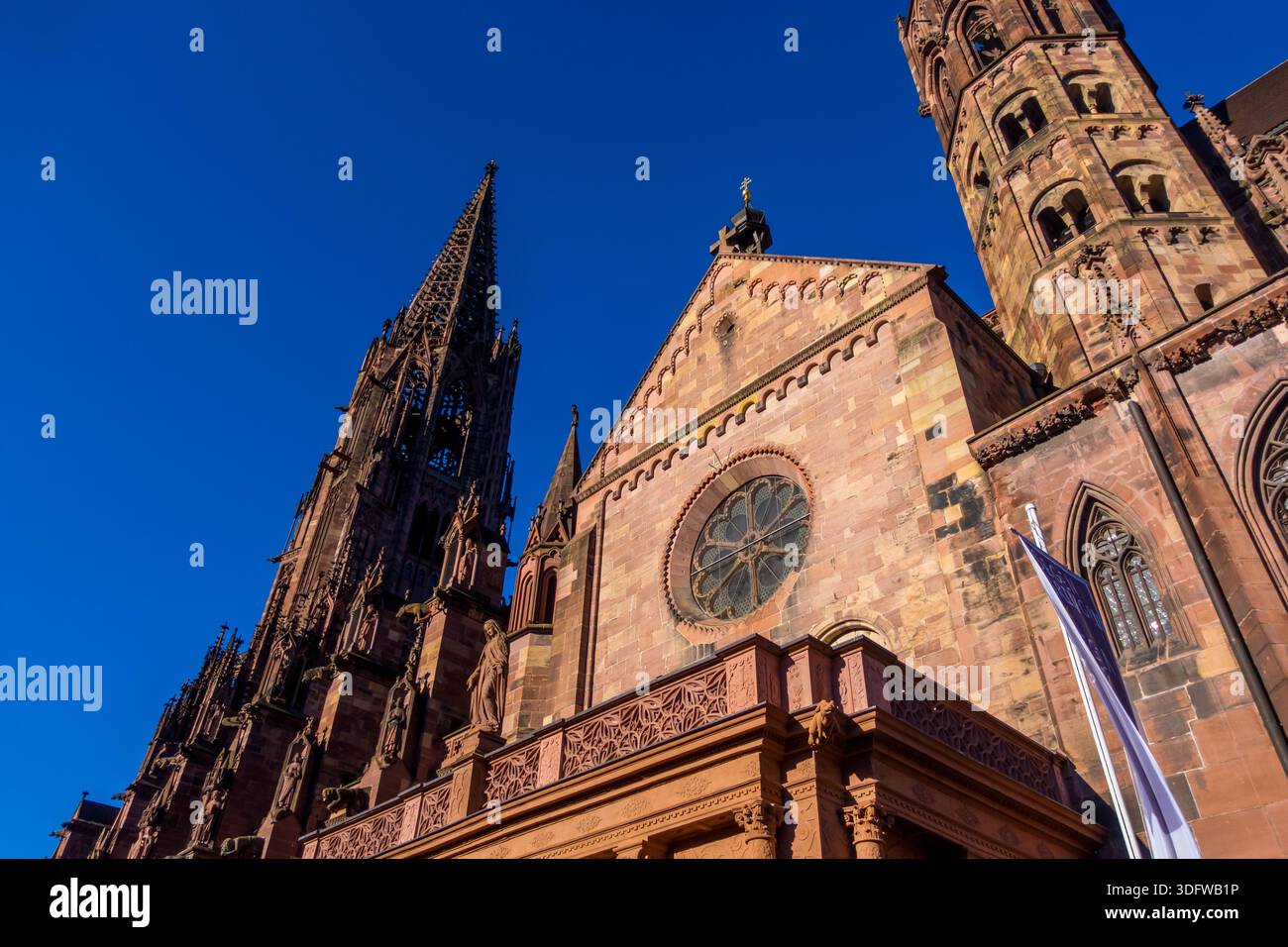 Low-angle view of Freiburg Cathedral (Muenster - Minster) in Freiburg, Germany - Stock Image