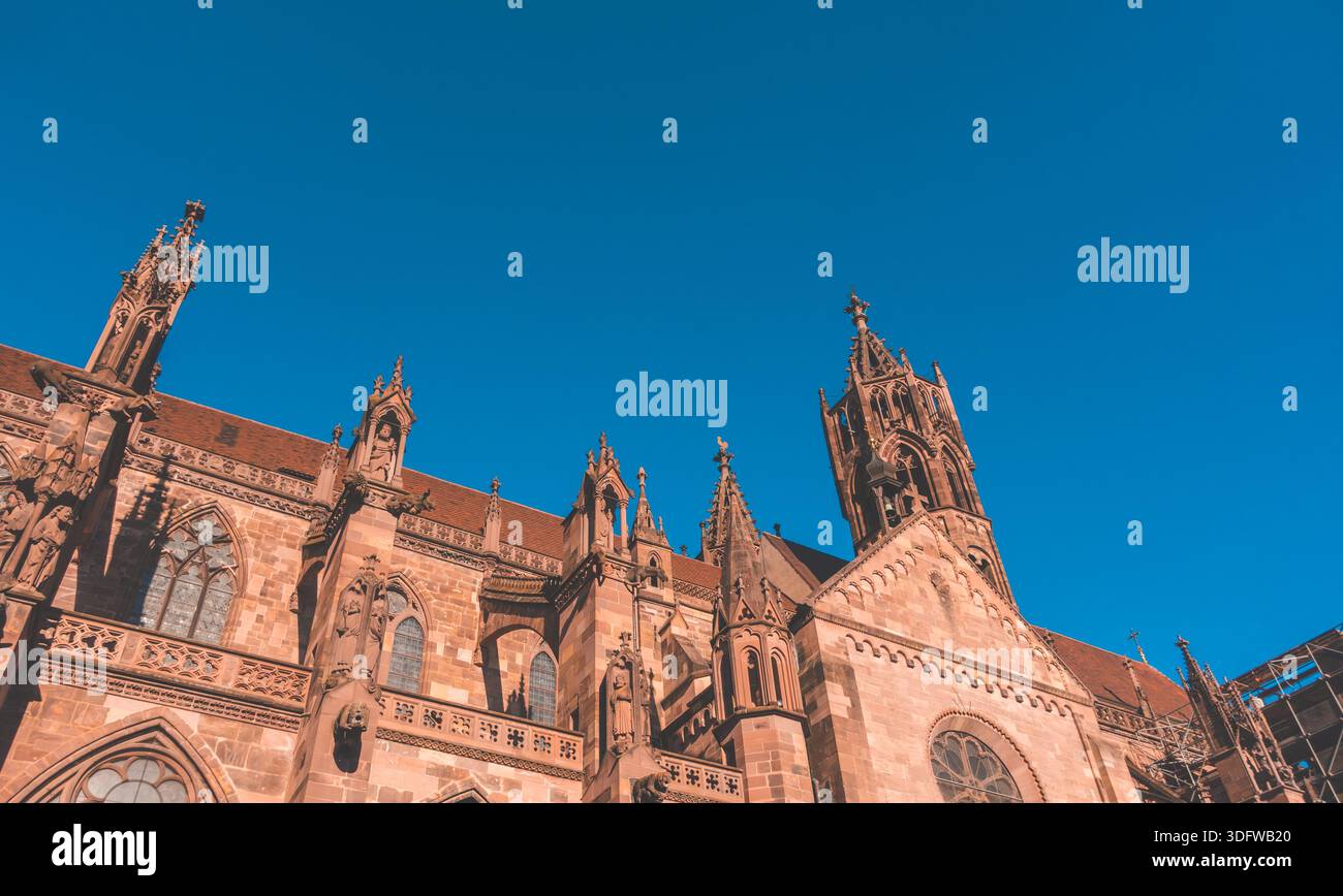 Low-angle view of Freiburg Cathedral (Muenster - Minster) in Freiburg, Germany - Stock Image