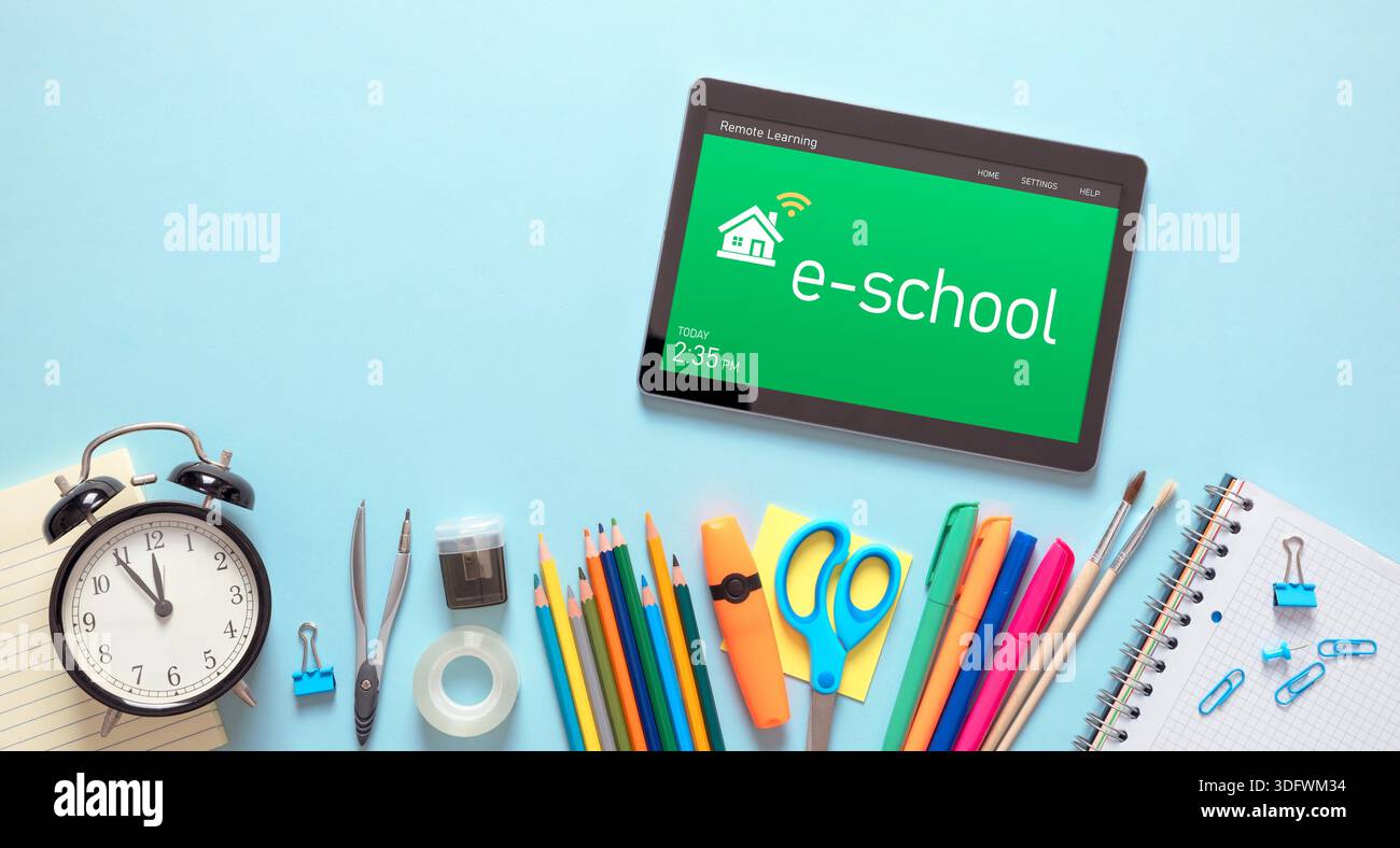 Remote learning, e-learning concept. Tablet with remote learning system, school supplies Stock Photo