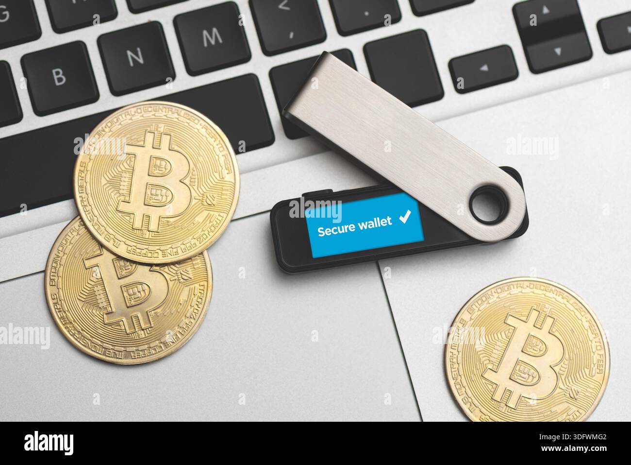 Saving cryptocurrency coins into secure digital wallet. Bitcoin secure  wallet Stock Photo - Alamy