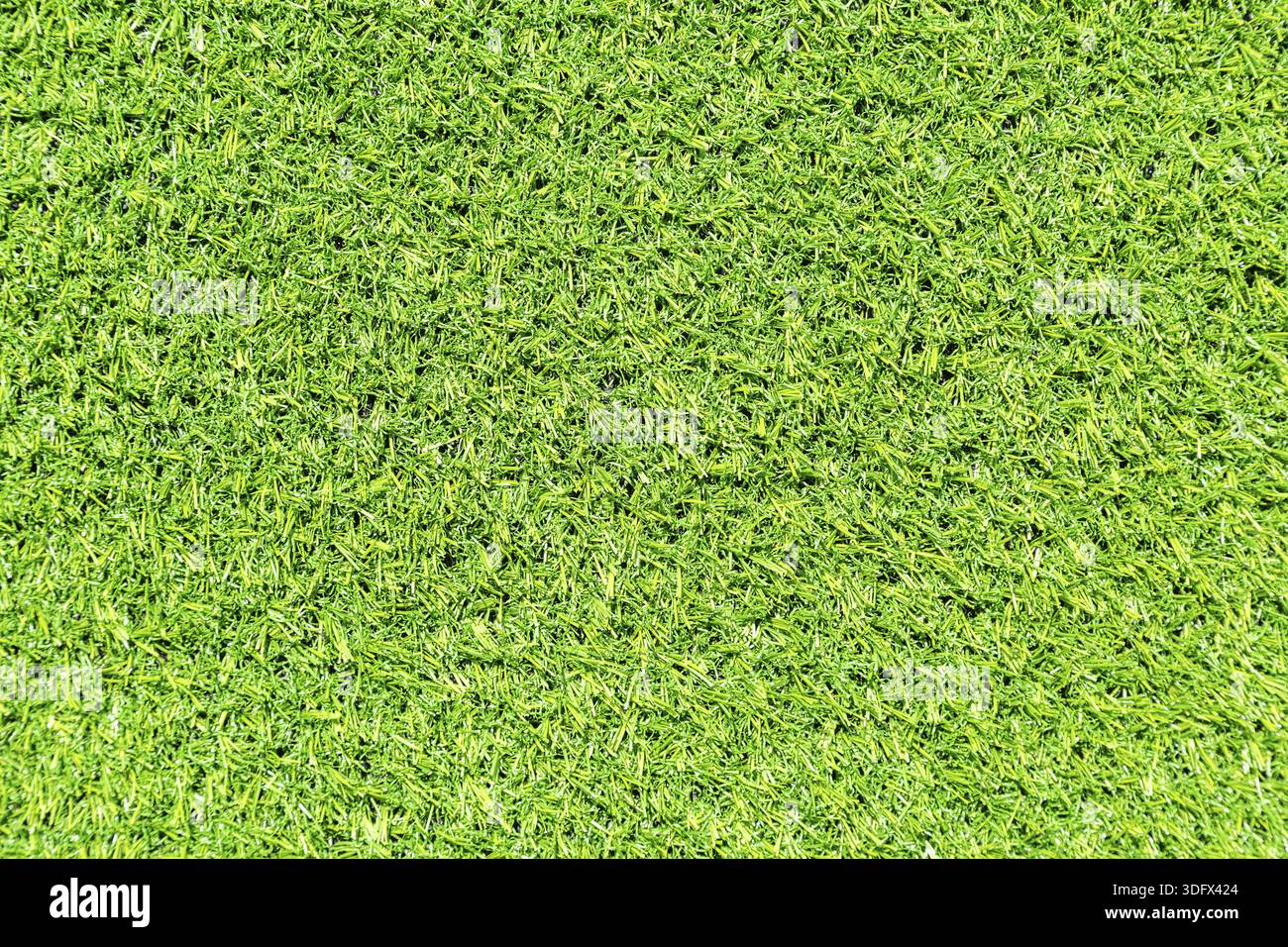 Decorative artificial green grass as background texture Stock Photo