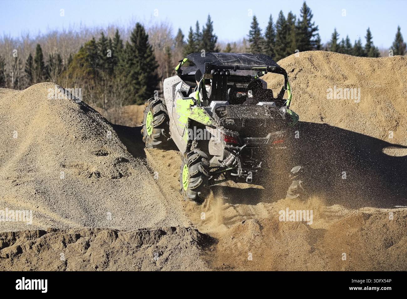 Engineer Ripping Up A side-by-side ripping up dirt as it goes up a gravel hill Stock Photo ...
