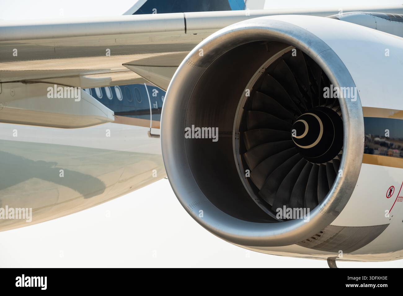 Close Up Of A Large Turbofan Jet Engine On An Airplane Wing Stock Photo close-up-of-a-large-turbofan-jet-engine-on-an-airplane-wing-stock-photo