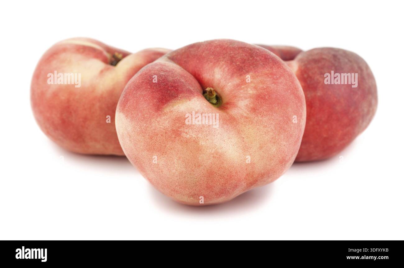 Three paraguayos flat peaches isolated on white background Stock Photo