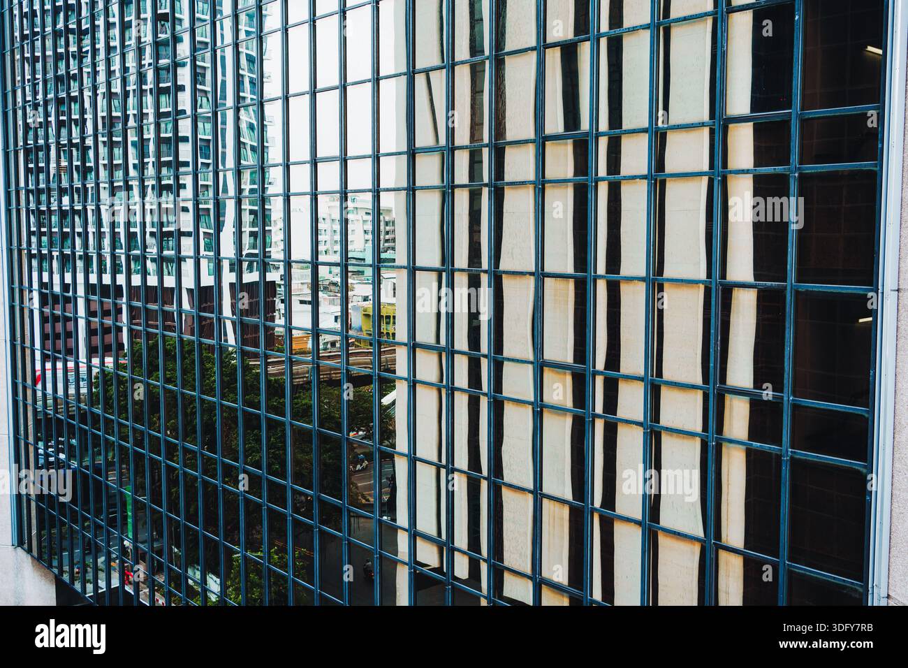 Grid Pattern Window Building Facade glass window with grid pattern on office building in Bangkok ...