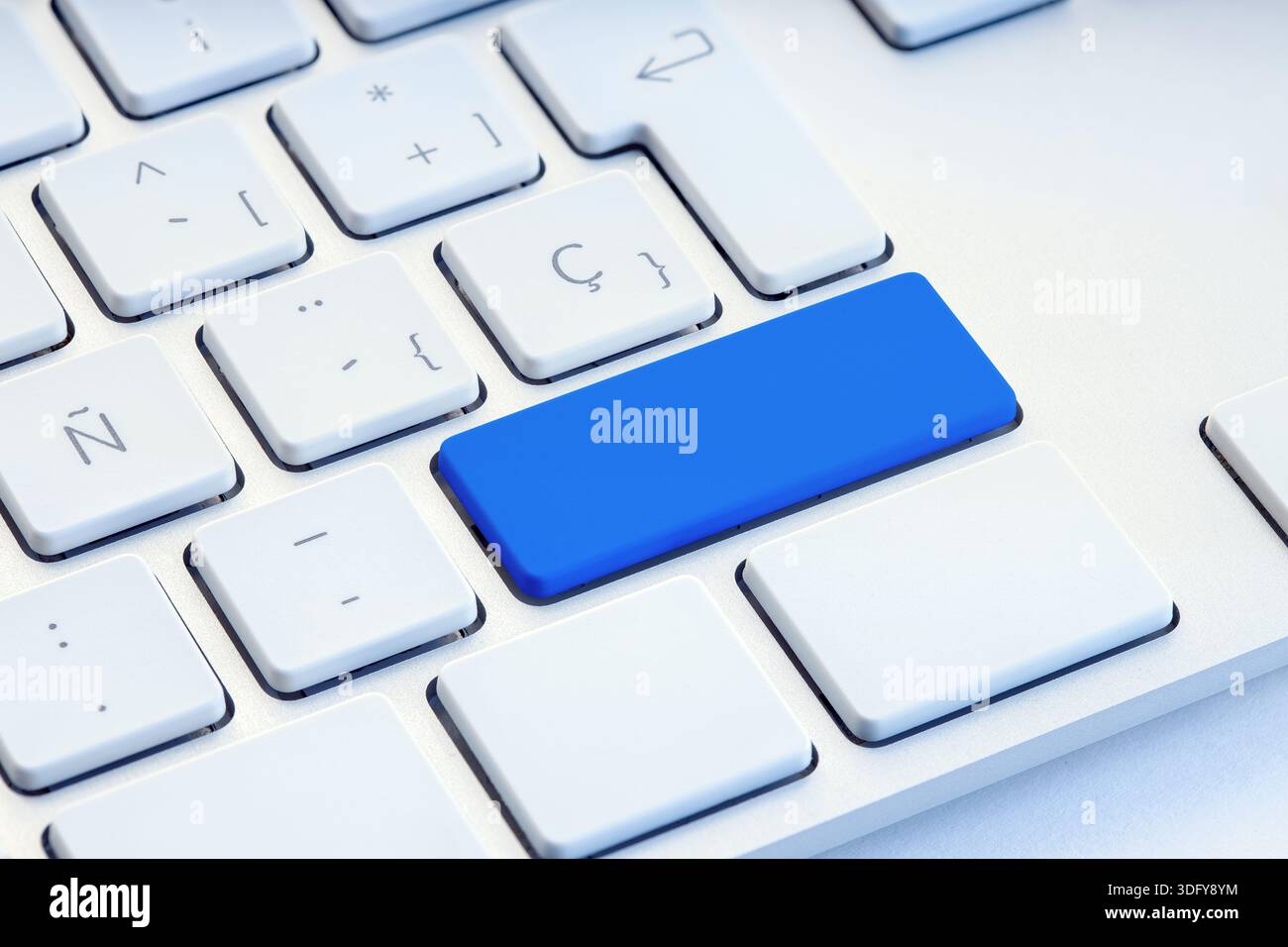 Blue blank key on white computer keyboard mockup Stock Photo
