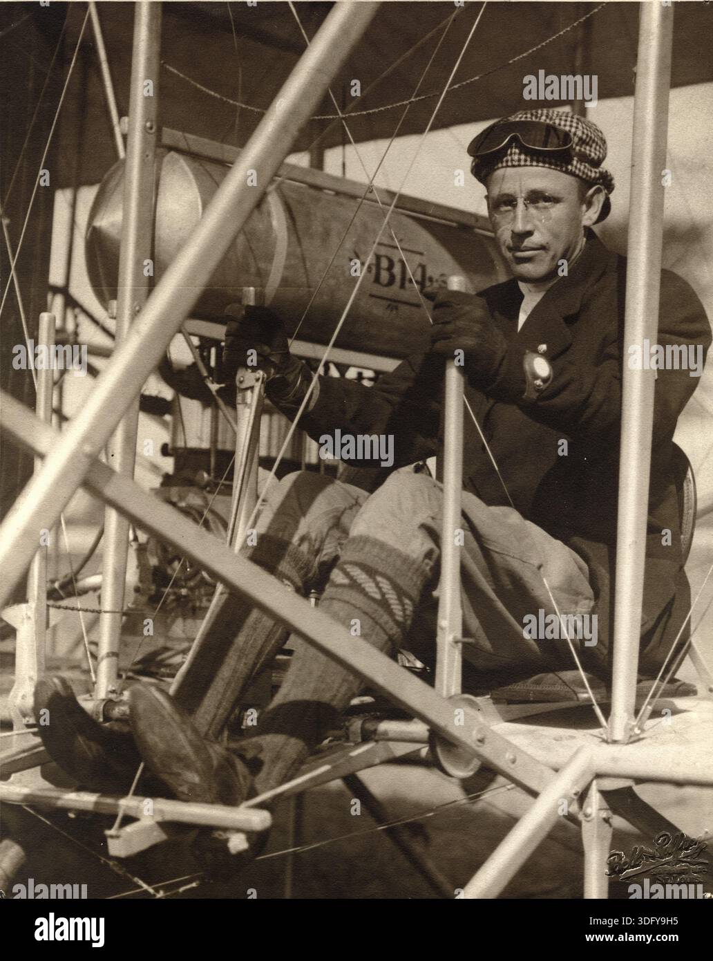 Pilot Arch Hoxsey seated in his plane after setting a nonstop