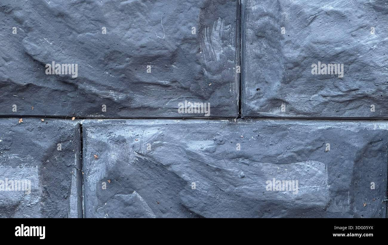 Textured Dark Gray Stone Wall for Modern Architecture Stock Photo