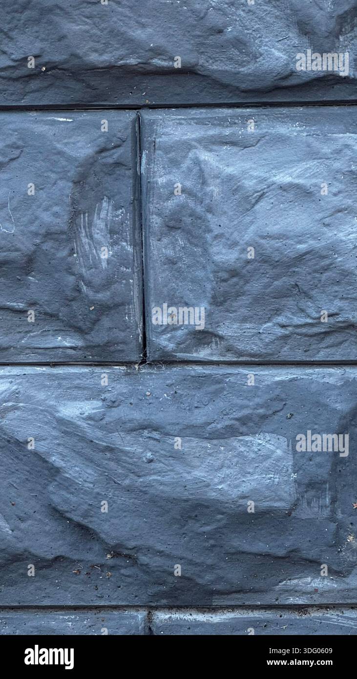 Textured Dark Gray Stone Wall Surface for Modern Design Projects Stock Photo