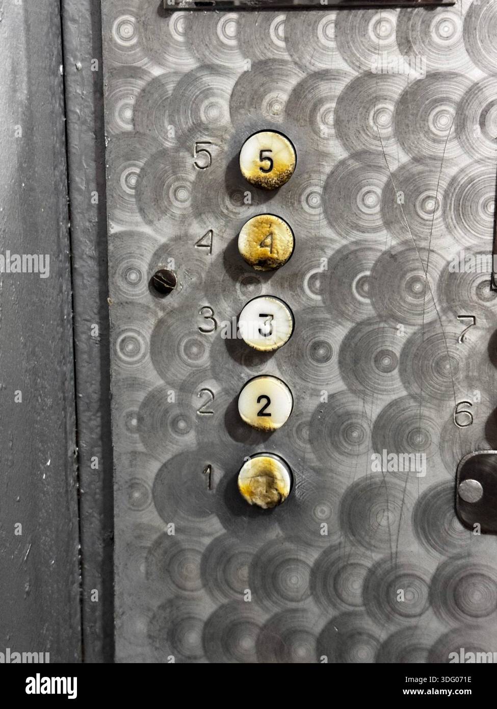 Vintage Elevator Buttons with Worn Numbers and Textures Stock Photo