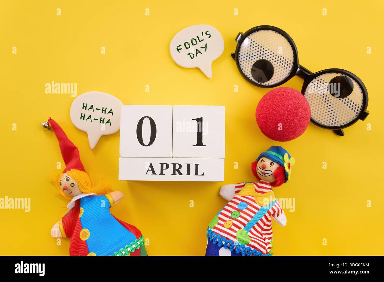 April fool's day celebrating humor with jester puppets and calendar ...