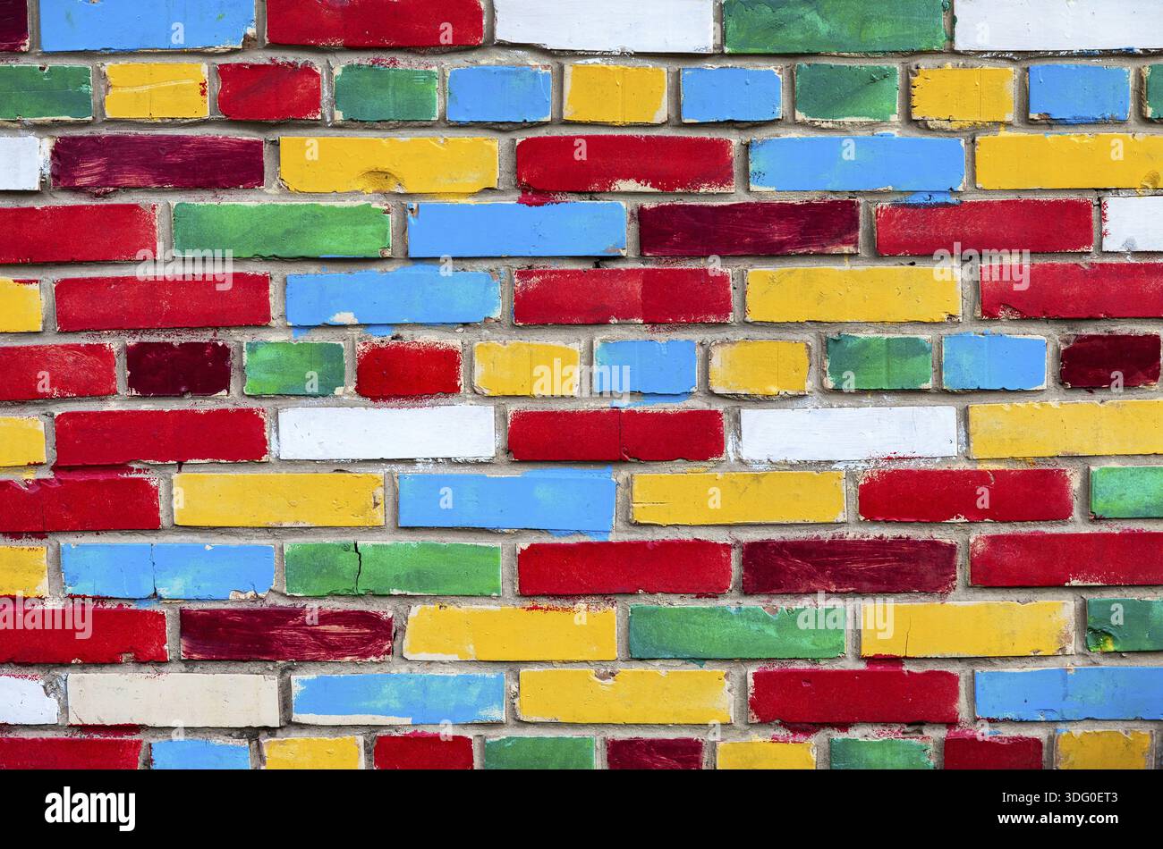 Colorful brick wall from multi colored bricks as a creative background texture Stock Photo