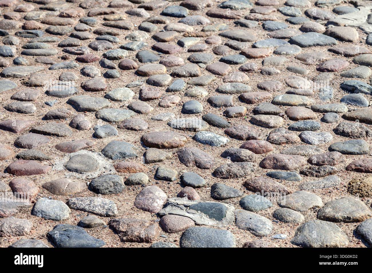 Old cobblestone pavement as creative background texture Stock Photo