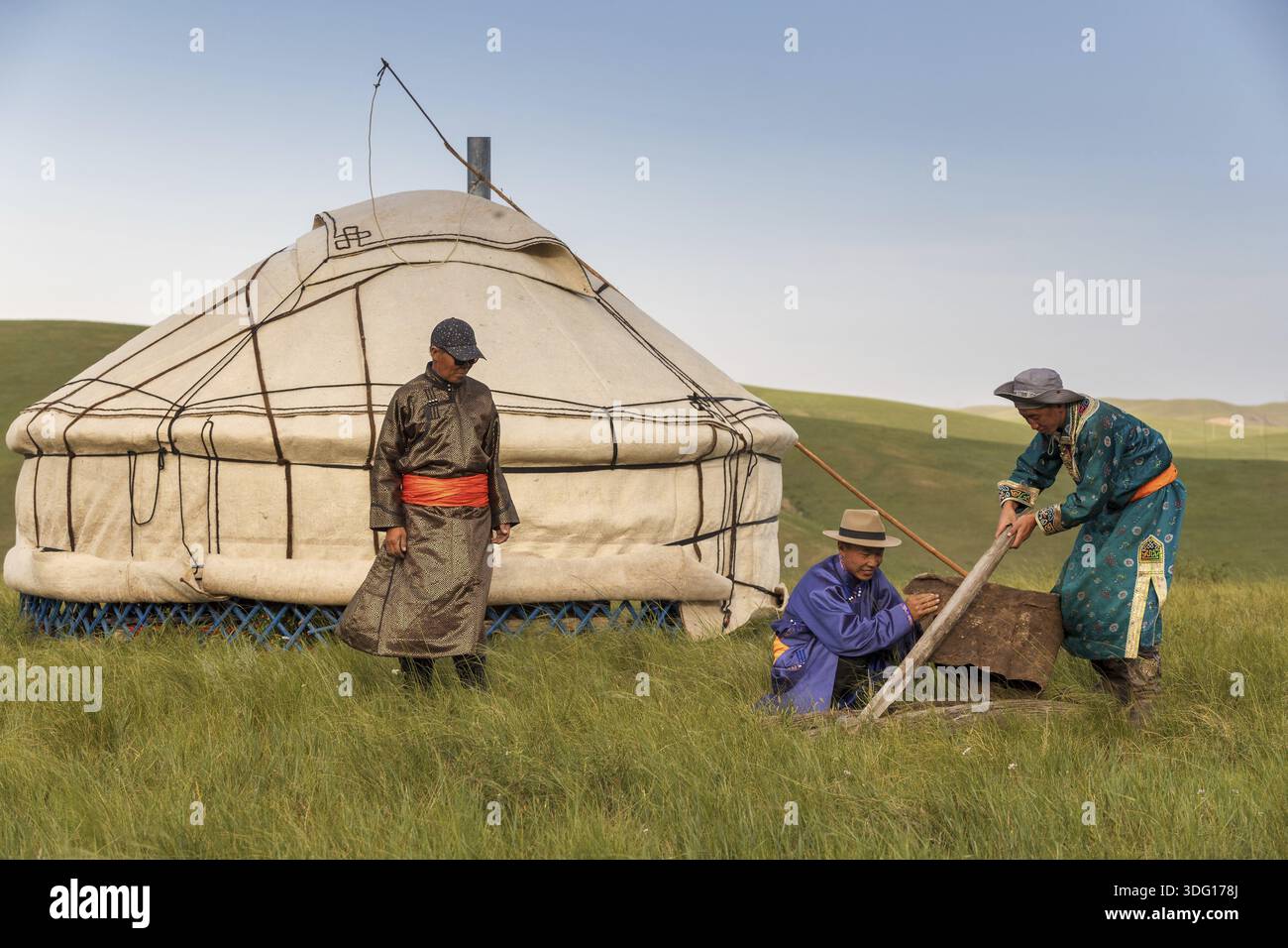 Members of a nomadic family dressed in their traditional clothes ...