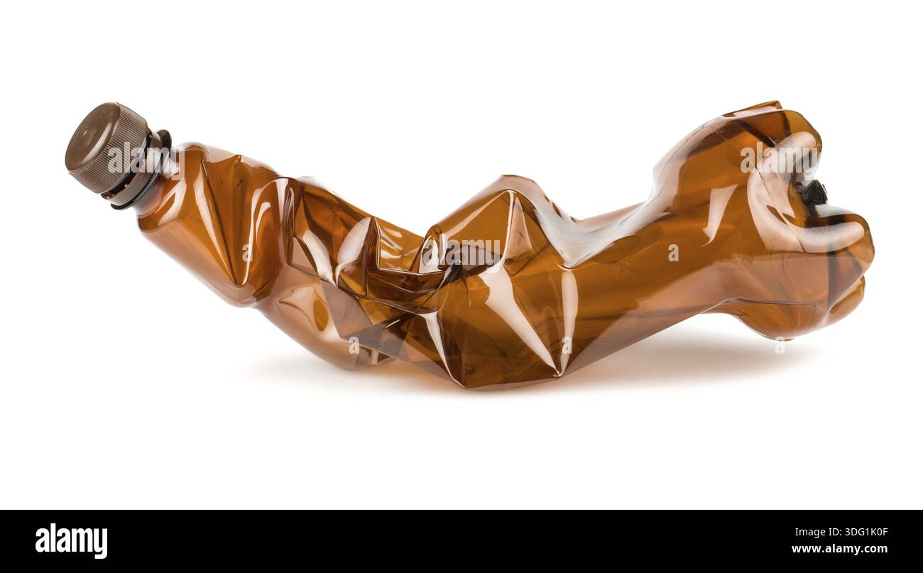 Crumpled brown plastic bottle isolated on white background Stock Photo
