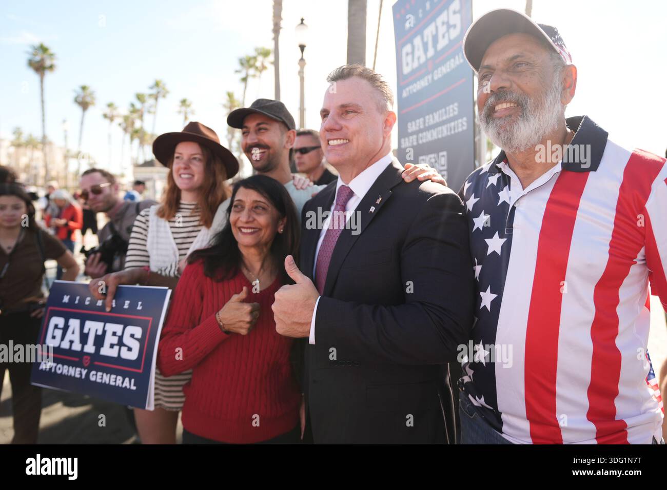 Michael Gates addresses poses for photos while announcing his candidacy ...