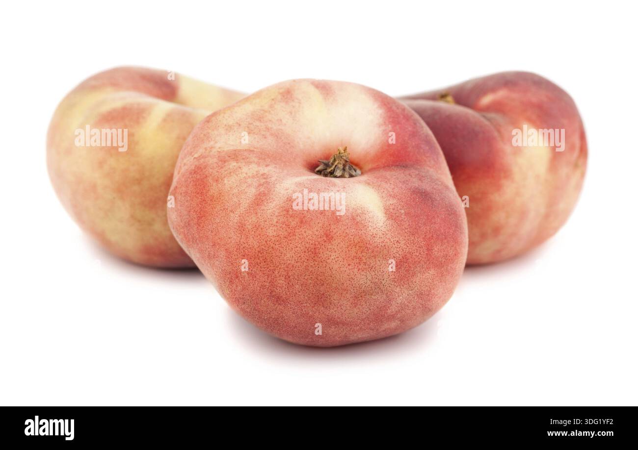Three paraguayos flat peaches isolated on white background Stock Photo