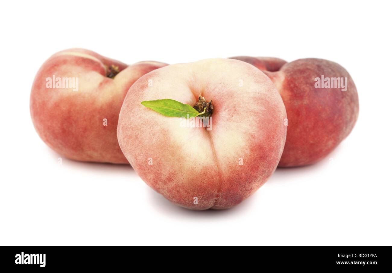 Three paraguayos flat peaches isolated on white background Stock Photo
