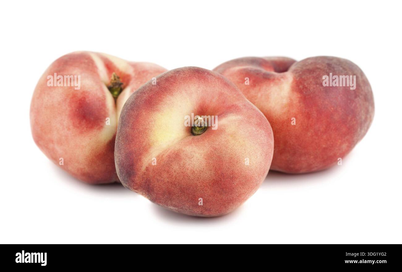 Three paraguayos flat peaches isolated on white background Stock Photo