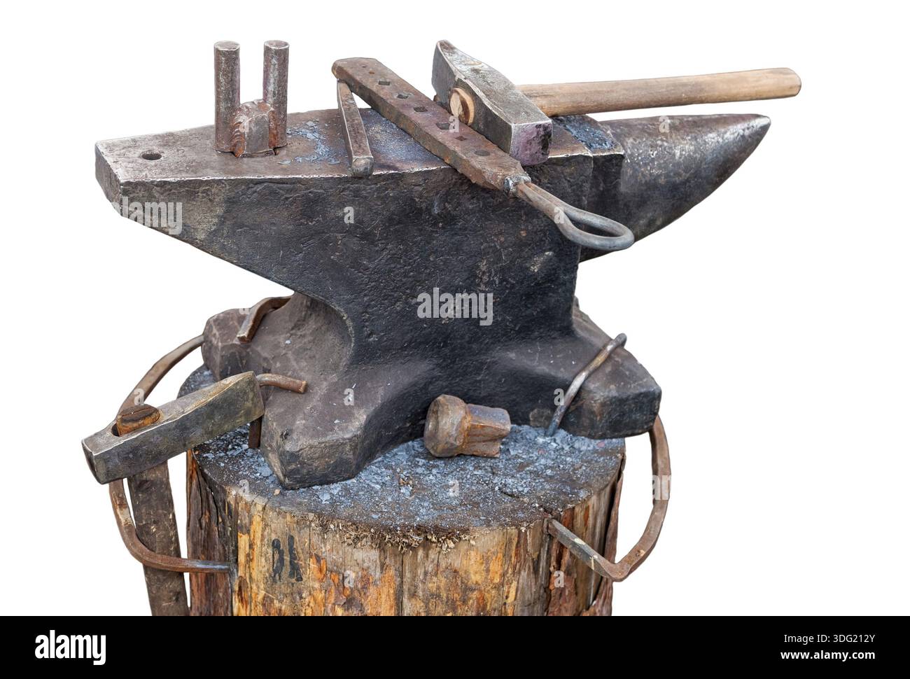 Old anvil with blacksmith tools isolated on white background Stock Photo