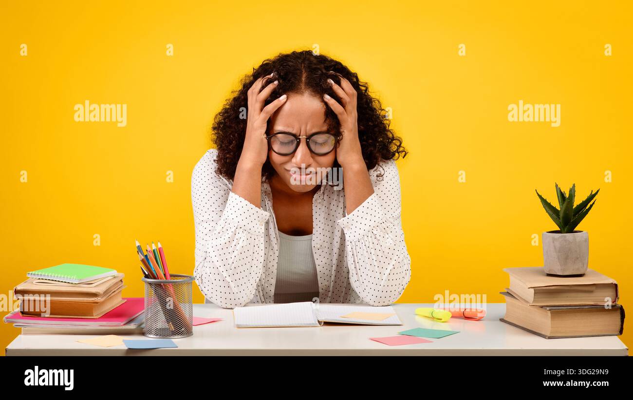 Student Struggles With Study Stress at Desk Covered With Books and ...