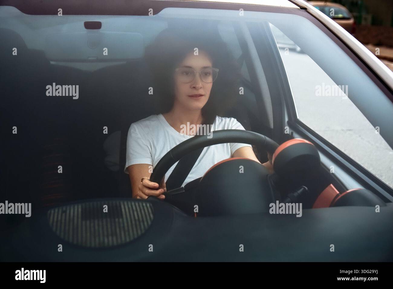 Woman focused on driving car hi-res stock photography and images - Alamy