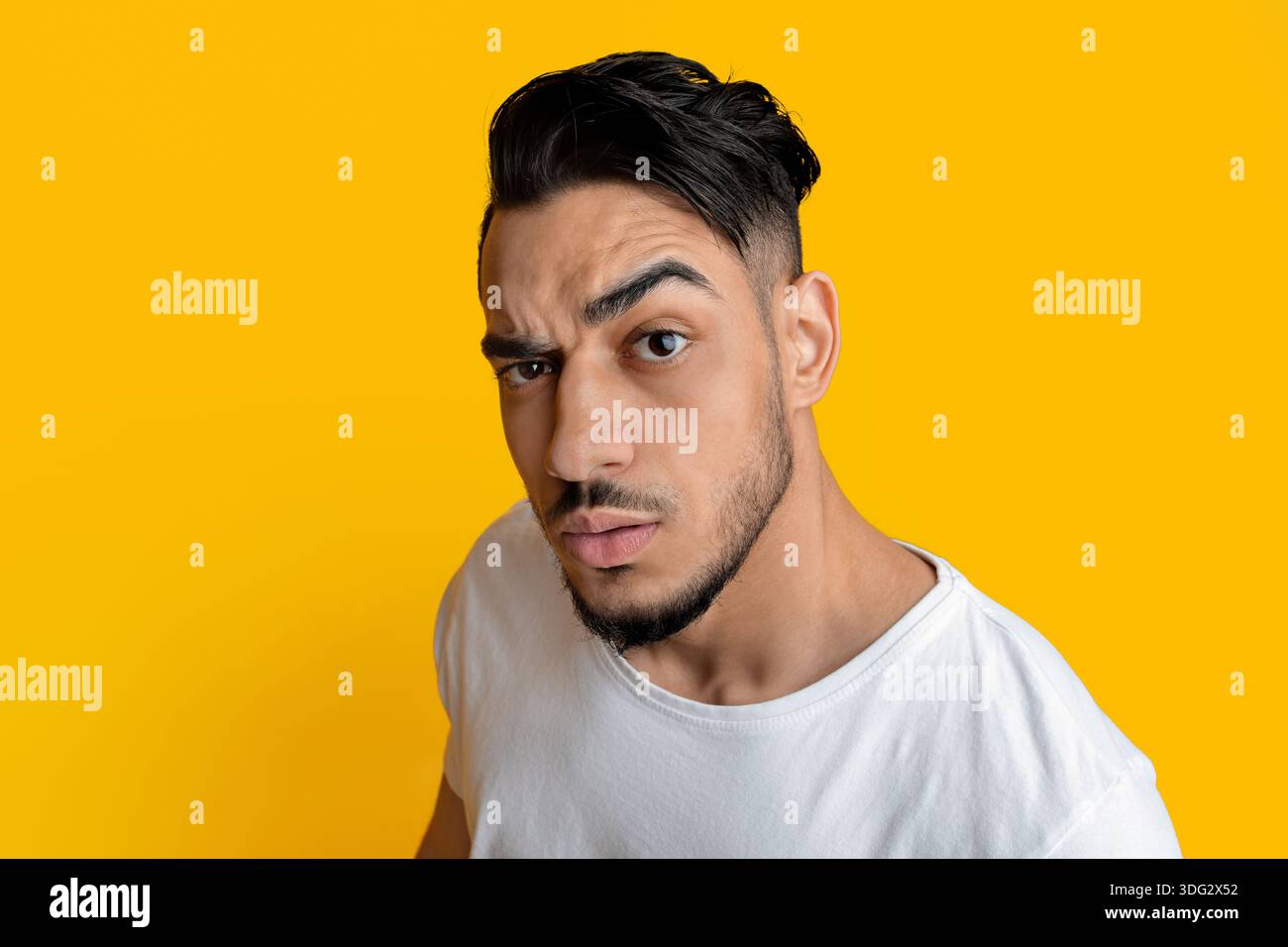 Top view of surprised arabic guy looking at camera Stock Photo