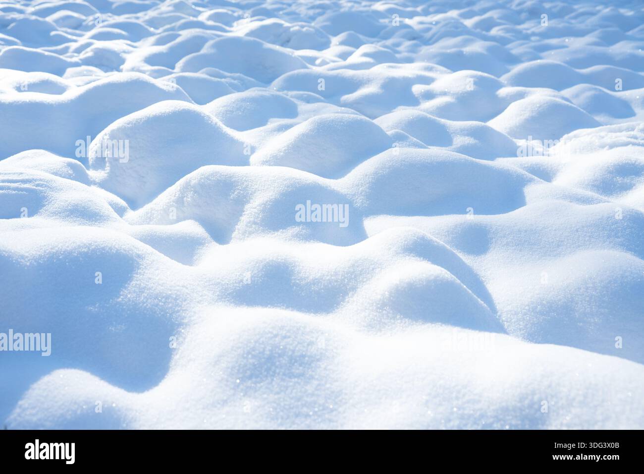 Snowdrifts as an abstract winter background Stock Photo