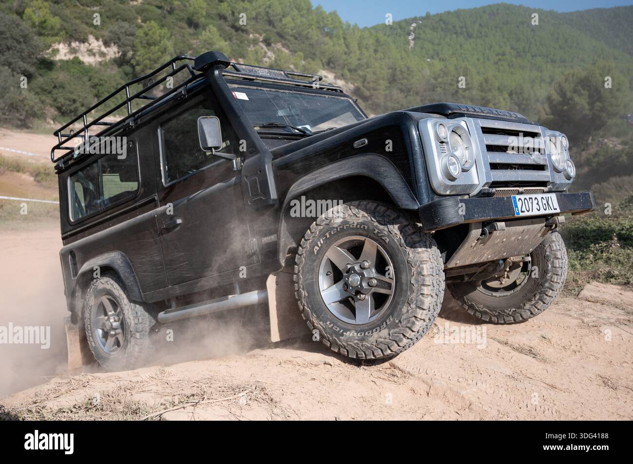 Modified black Land Rover Defender short wheelbase reaching the top of ...
