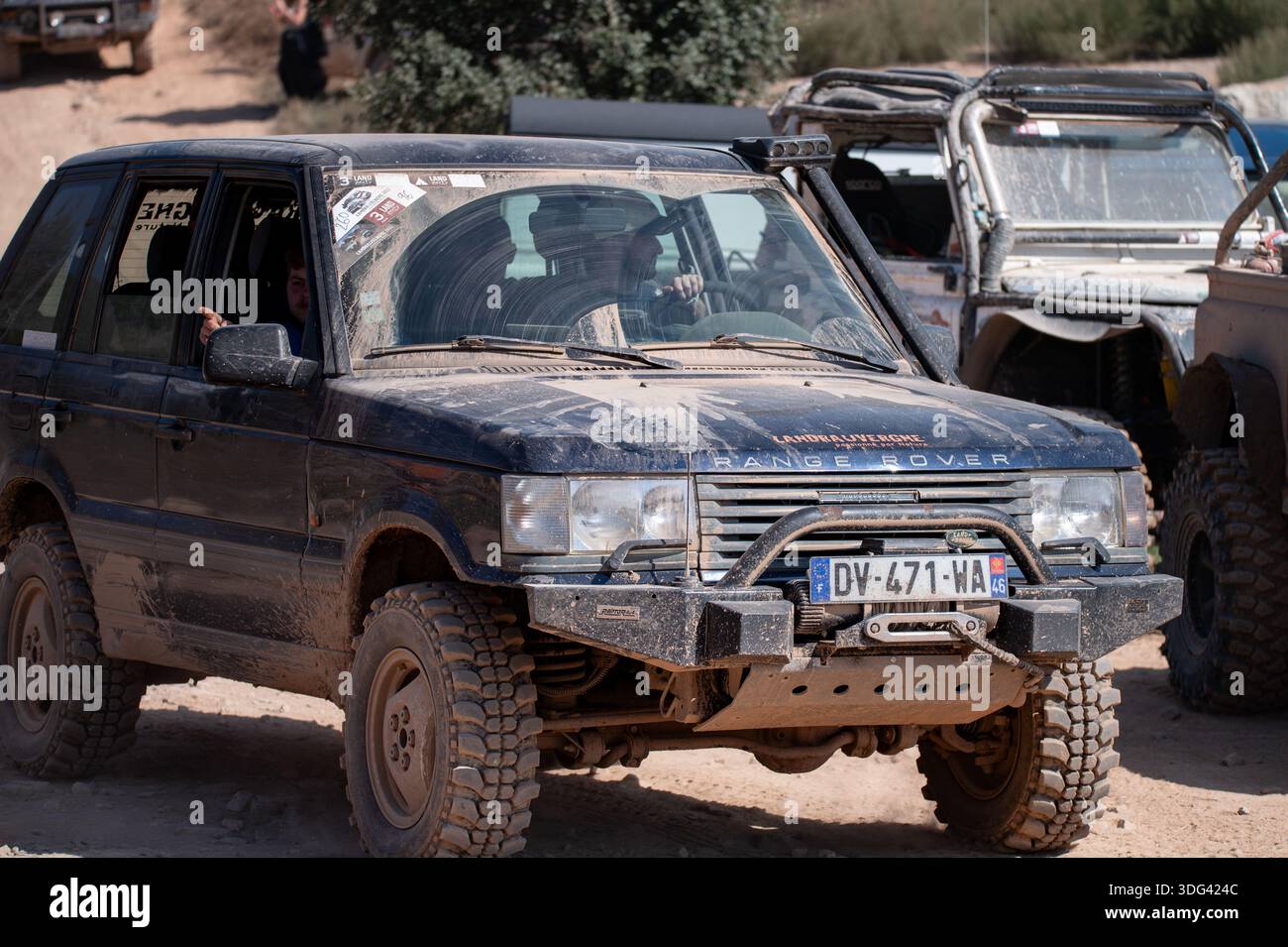 Front view of a blue modified Range Rover P38 luxury SUV. Features a ...