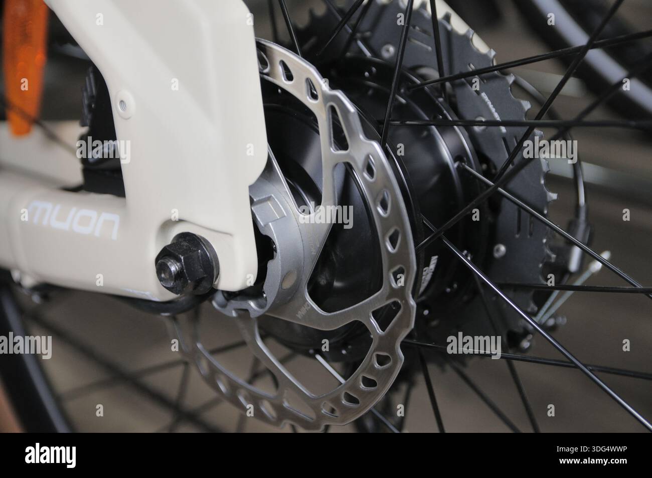 Close-up of the front wheel of an urban electric bicycle featuring a ...