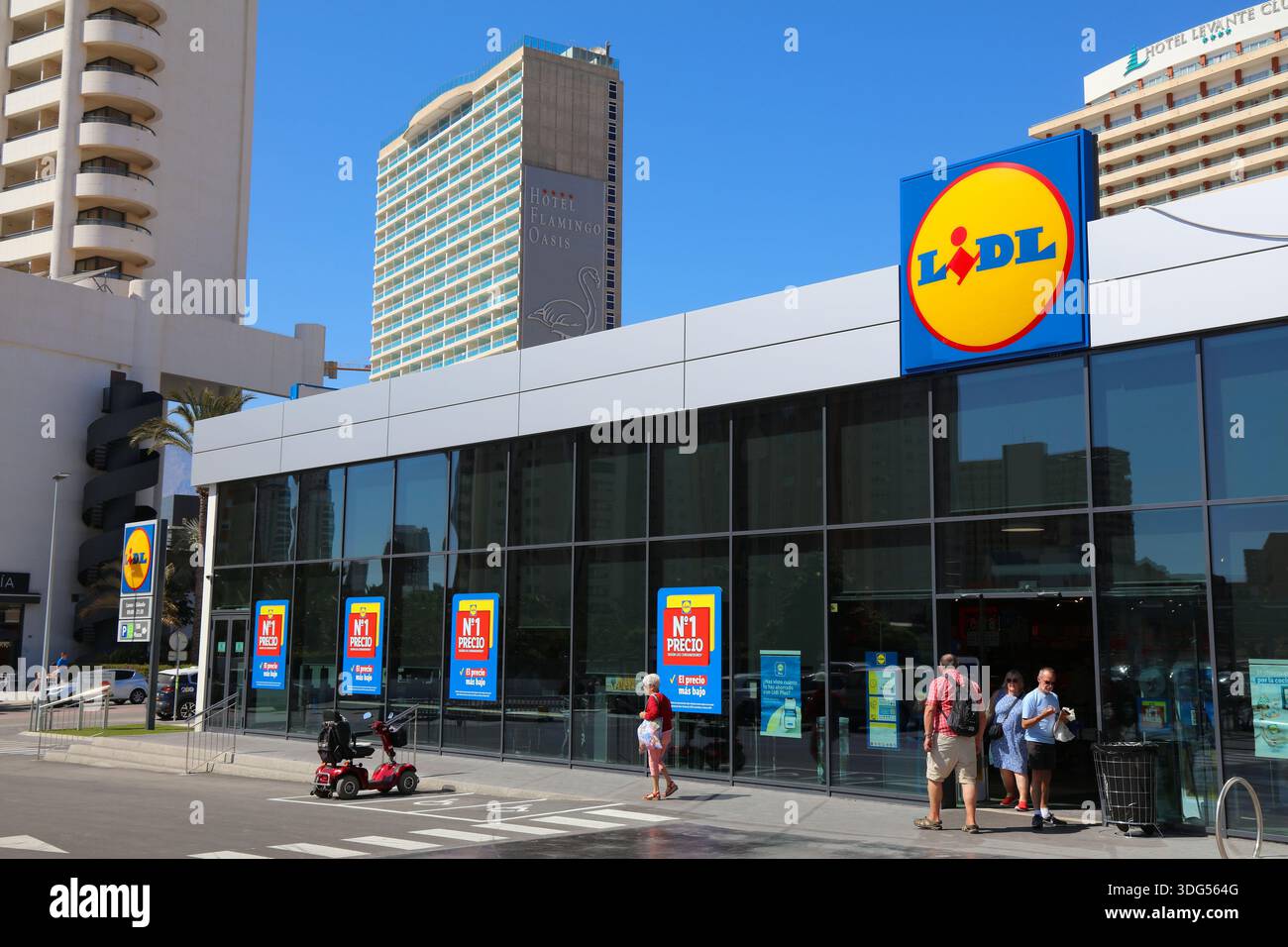 BENIDORM, SPAIN - APRIL 8, 2025: People visit Lidl supermarket in Benidorm, Spain. Lidl is part of Schwarz Group, one of largest grocery store chains Stock Photo