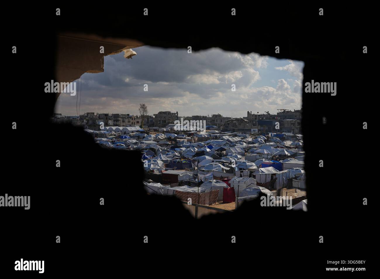 A tent camp for displaced Palestinians stretches across Deir al-Balah ...