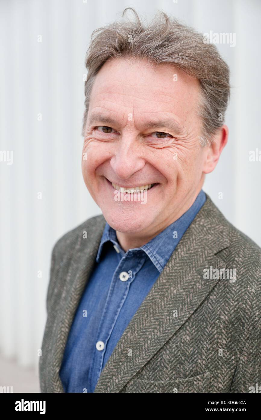 Older man in blue shirt hi-res stock photography and images - Alamy