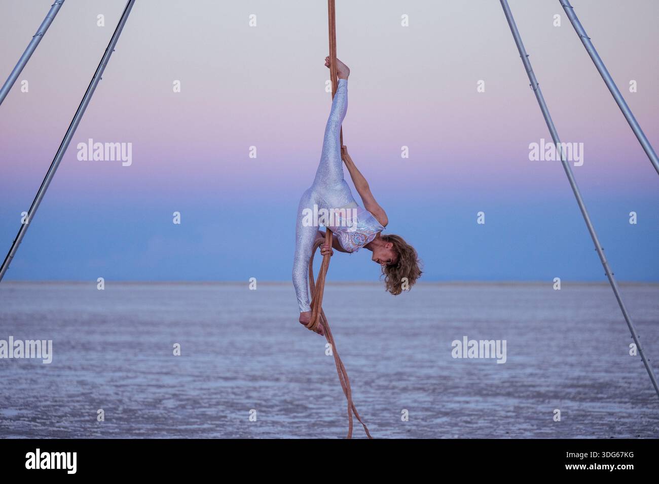Aerial performer hangs upside hi-res stock photography and images - Alamy
