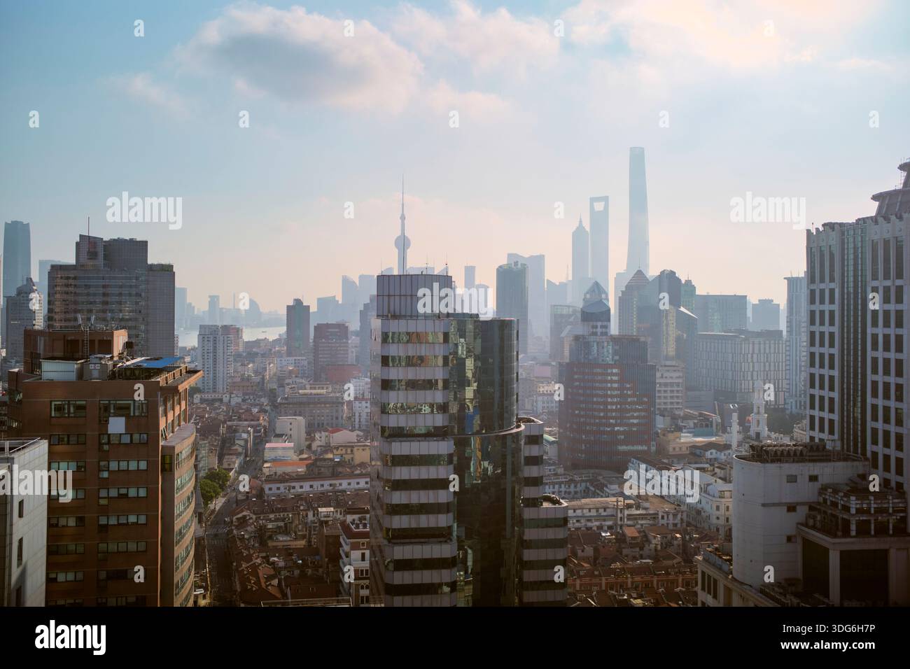 Panoramic cityscape of Shanghai with towering skyscrapers and a hazy ...