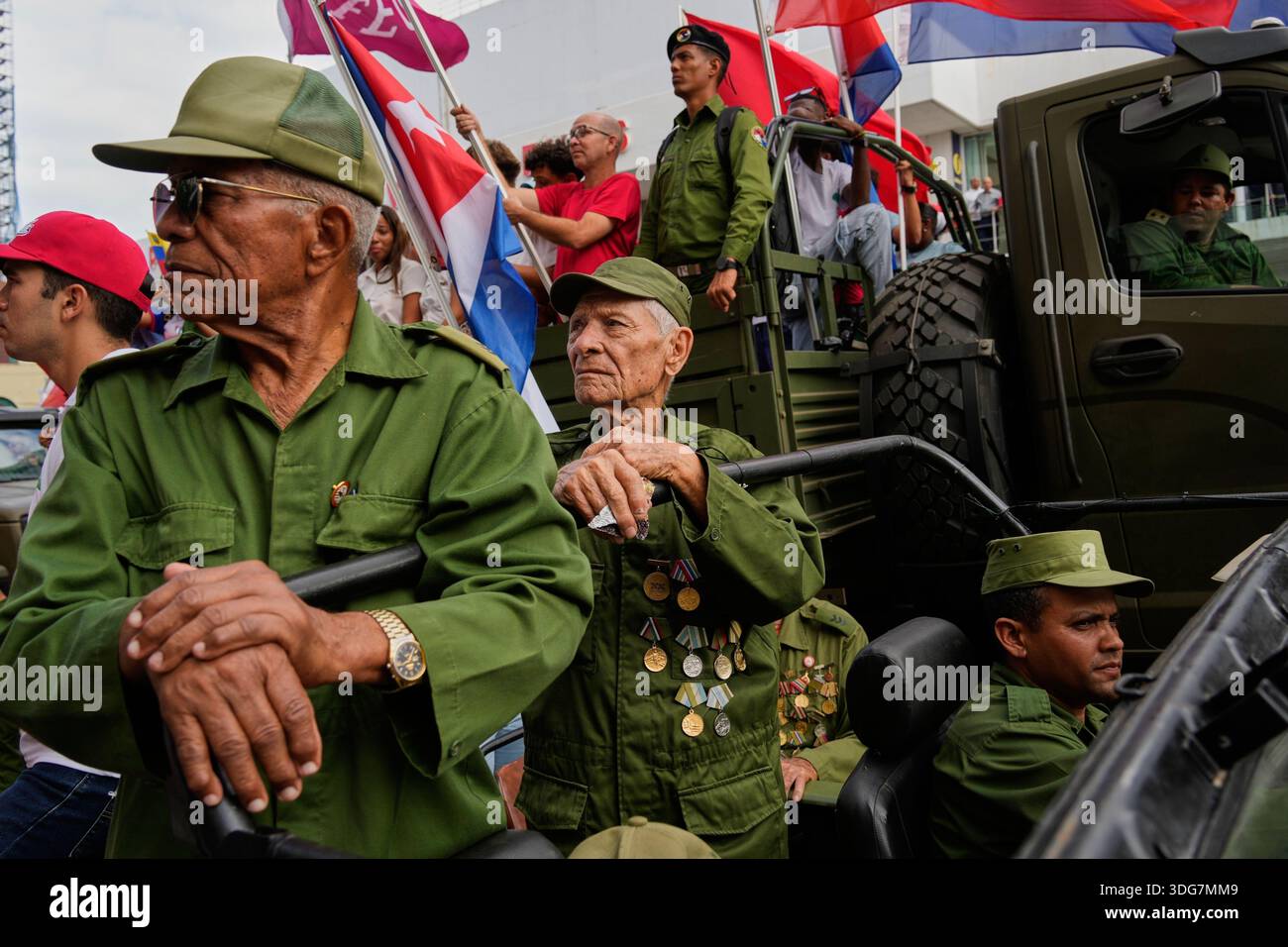 FILE - Veterans of the 1959 Cuban Revolution take part in a parade ...