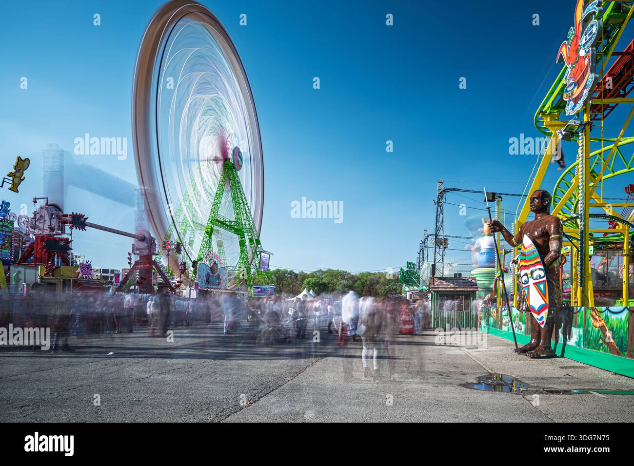 Daytime long exposure at Seville's April Fair amusement park, capturing ...