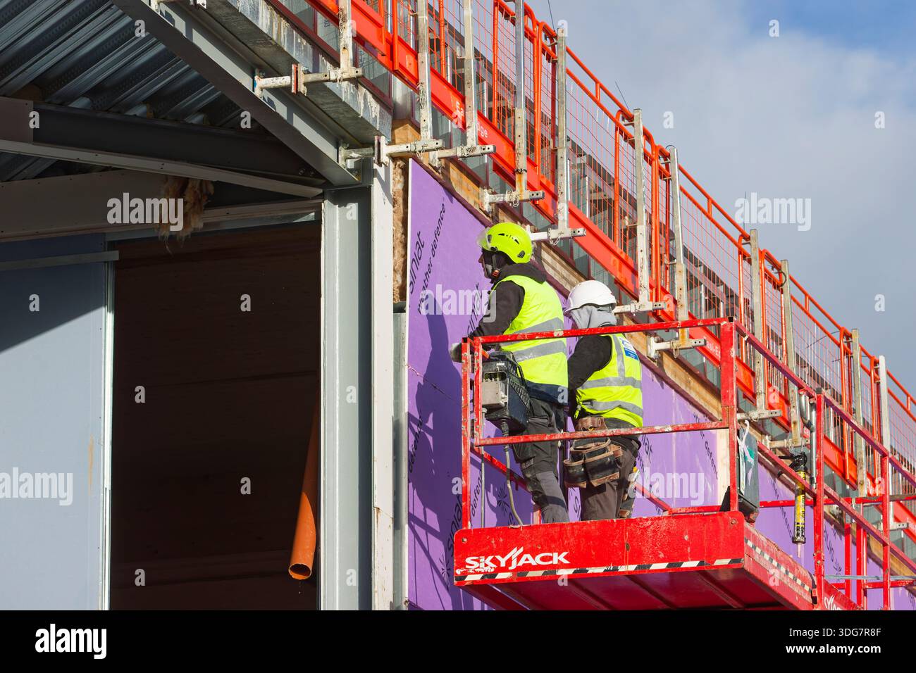 Two construction workers aerial access platform hi-res stock ...