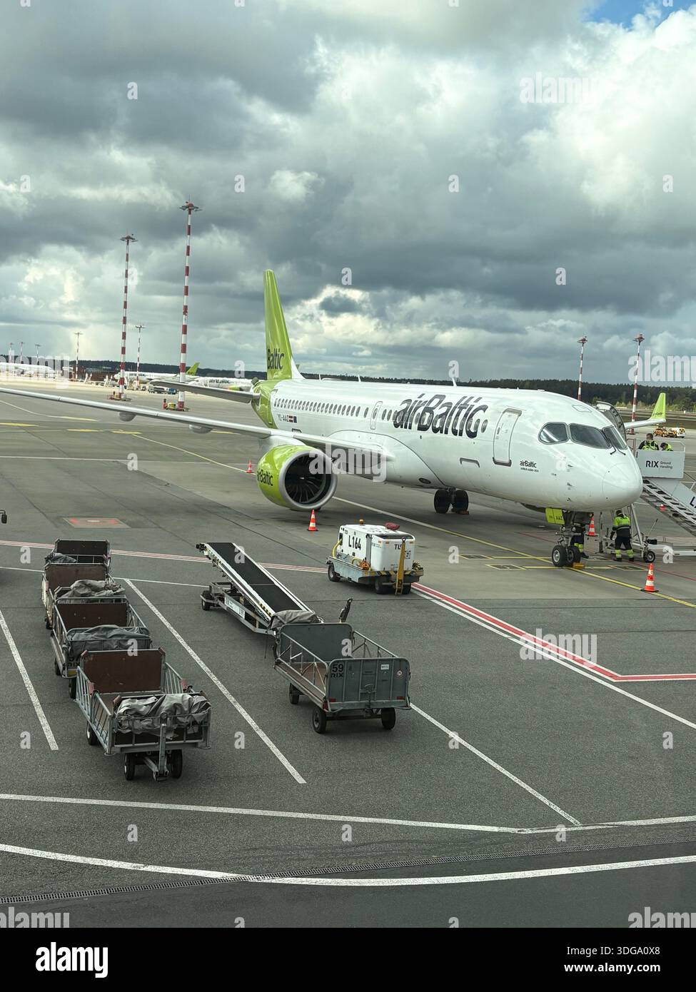 Airbaltic aircraft green tail hi-res stock photography and images - Alamy