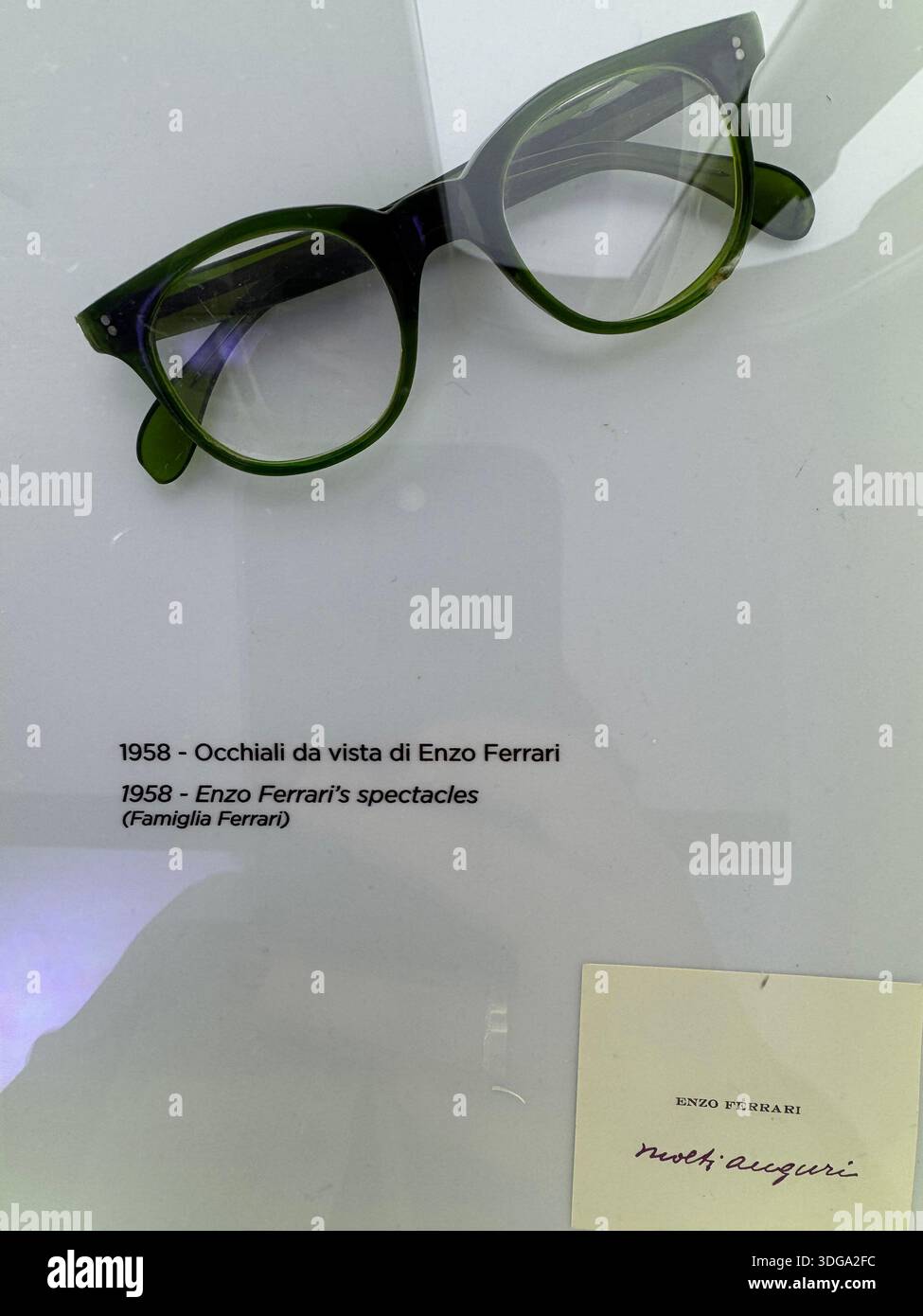Eyeglasses worn by Enzo Ferrari in 1958, displayed at the Ferrari Museum in Modena, Italy, highlighting the personal history behind the iconic brand - Smartphone Captured Stock Image